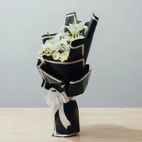 Elegant Serenity: White Lily & Gerbera Black Bouquet
