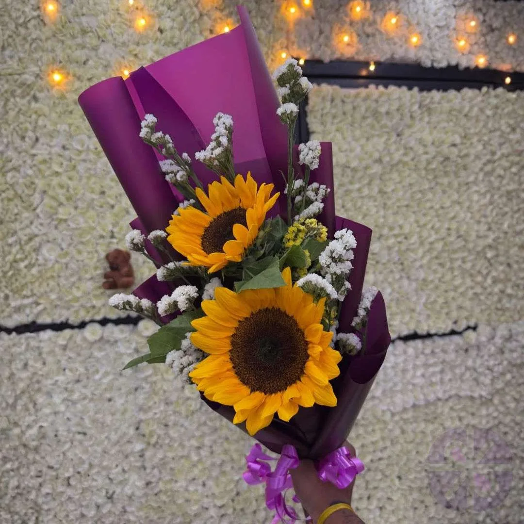 The Purple Glow Two Sunflowers & White Bloom Bouquet